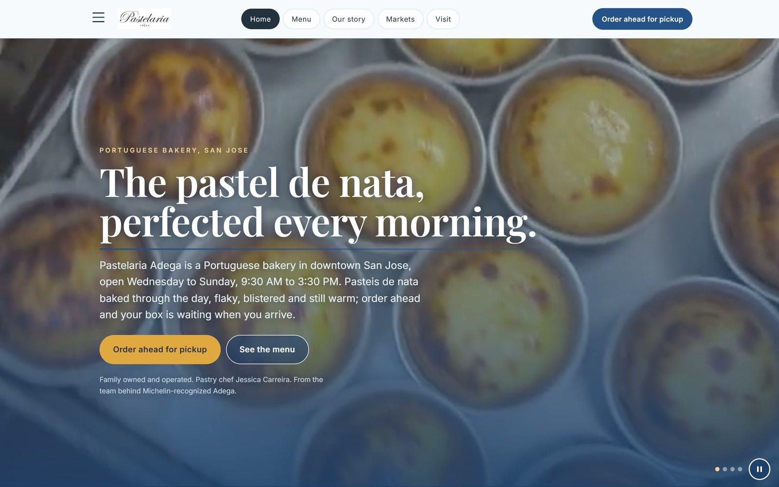 Pastelaria Adega's home page: &ldquo;The pastel de nata, perfected every morning.&rdquo; over a film of the bakery at work