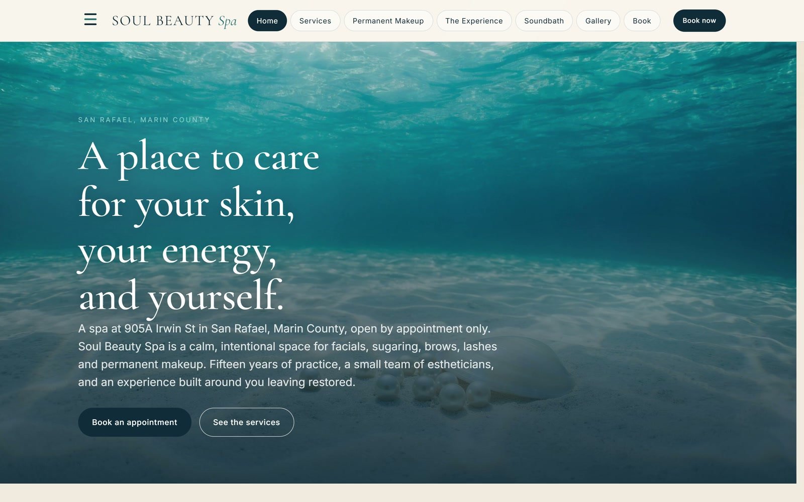Soul Beauty Spa's home page: &ldquo;A place to care for your skin, your energy, and yourself.&rdquo; over calm blue water