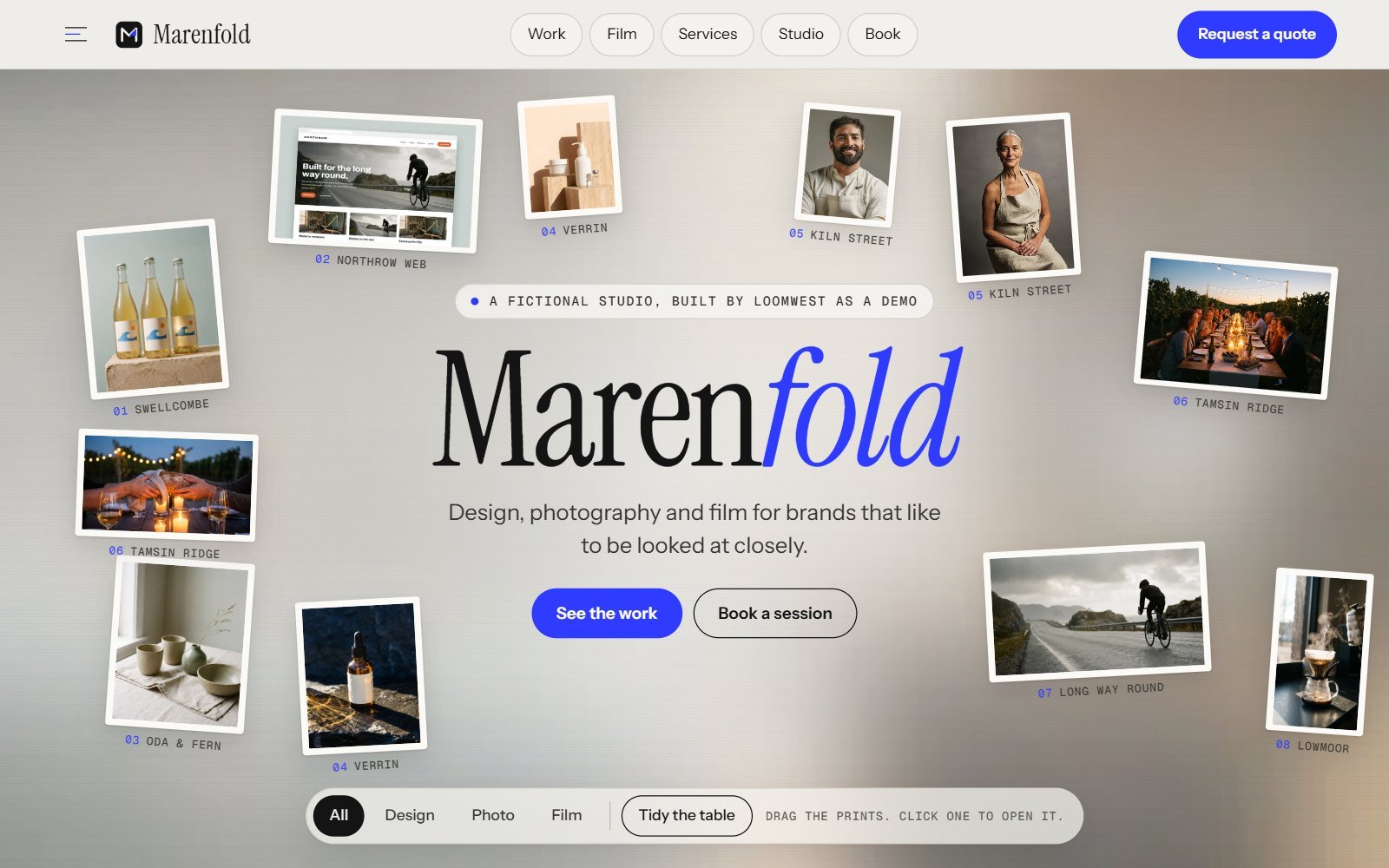 Marenfold, a fictional design, photography and film studio demo: a light table of loose prints scattered around the studio name