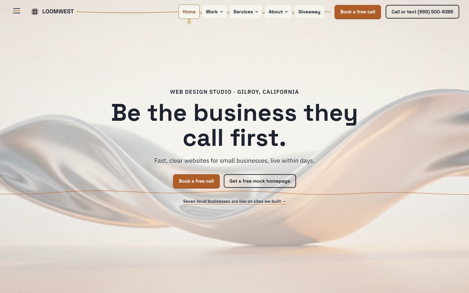 The Loomwest home page: the headline Be the business they call first., one line, Fast, clear websites for small businesses, live within days, and Book a free call and Get a free mock homepage buttons over a silk film